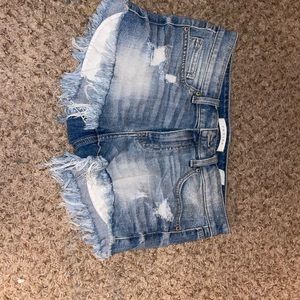 Blue and ripped jean shorts